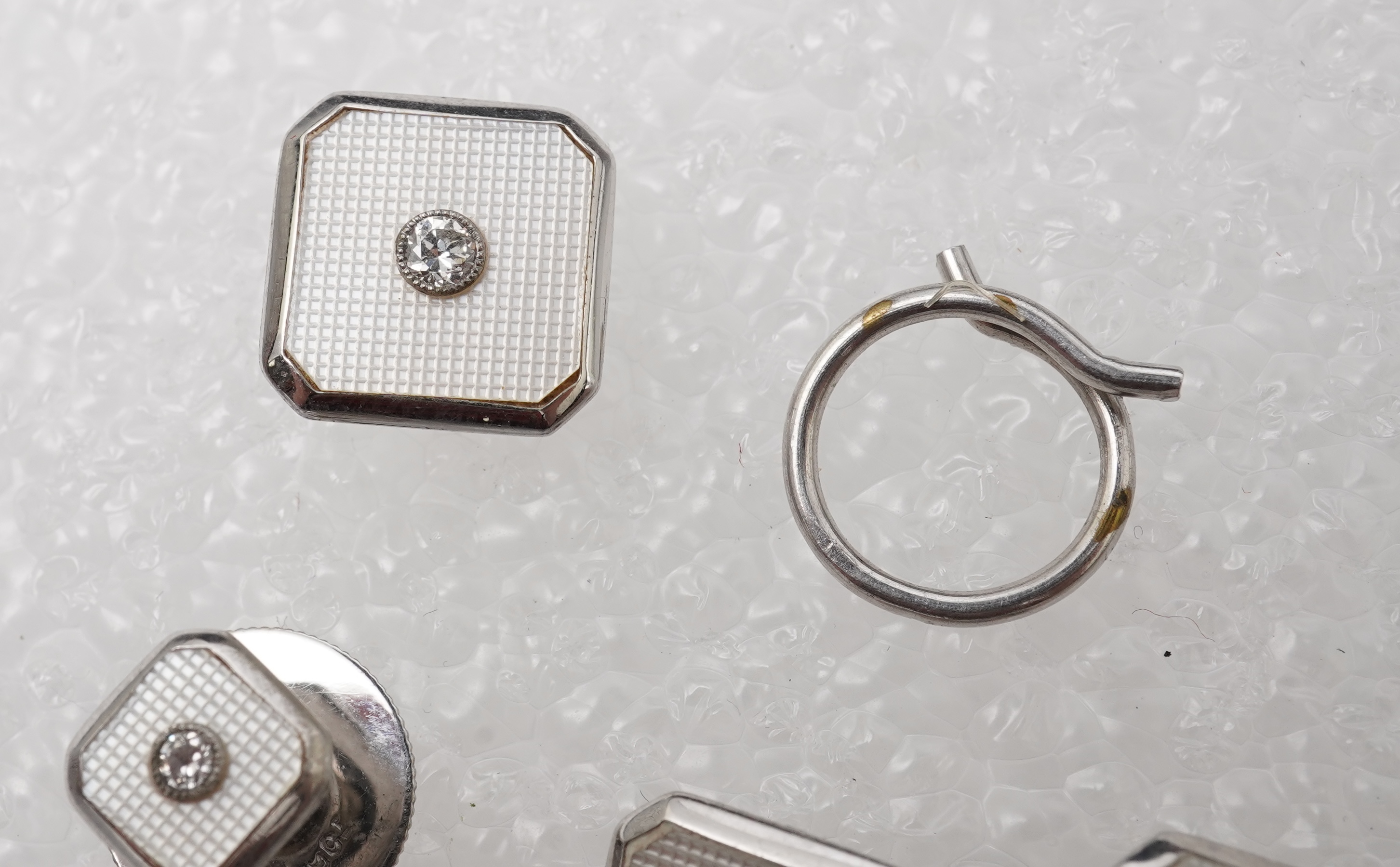 An Art Deco mother of pearl and diamond dress set, circa 1930